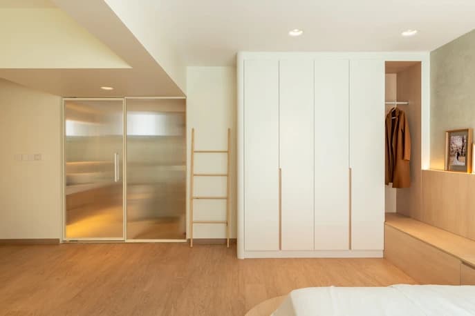 Contemporary master bedroom design with a cozy platform bed and elegant lighting accents.